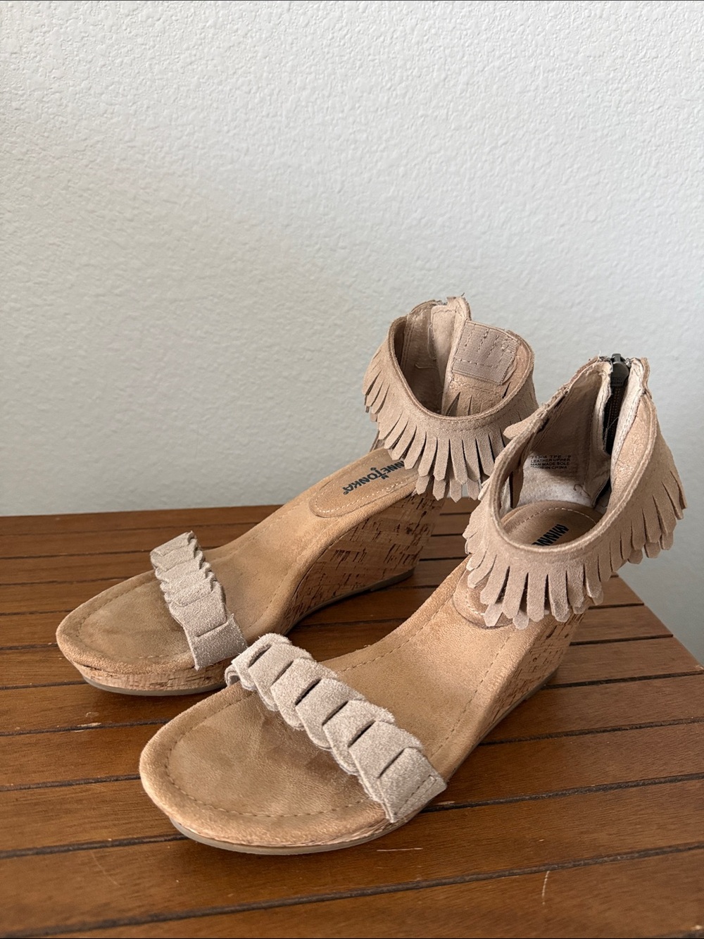 Minnetonka Suede Fringe Wedge Sandals in Tan